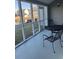 Screened porch with patio furniture and pond view at 1650 Deer Creek Rd., Surfside Beach, SC 29575