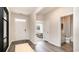 Modern entryway with dark wood floors and a view of a bedroom and bathroom at 183 Calm Dr., Little River, SC 29566