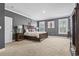 Bedroom with gray walls, wood bed frame, and window shutters at 208 Switch Grass Ct., Myrtle Beach, SC 29579