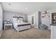 Bedroom with a white bed frame and plush seating at 208 Switch Grass Ct., Myrtle Beach, SC 29579