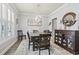Dining room with a wooden table, chandelier, and sideboard at 208 Switch Grass Ct., Myrtle Beach, SC 29579
