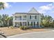 Two-story house with gray siding, white accents, and a balcony at 208 Switch Grass Ct., Myrtle Beach, SC 29579