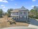 Two-story home with gray siding, balcony, and landscaped yard at 208 Switch Grass Ct., Myrtle Beach, SC 29579