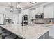 Modern kitchen with white cabinets, granite counters and island at 208 Switch Grass Ct., Myrtle Beach, SC 29579