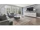 Spacious living room with gray sectional sofa and large TV at 208 Switch Grass Ct., Myrtle Beach, SC 29579
