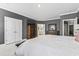 Spacious main bedroom with carpeting, large bed, and en-suite bathroom at 208 Switch Grass Ct., Myrtle Beach, SC 29579