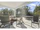 Relaxing screened porch with wicker furniture and wooded views at 208 Switch Grass Ct., Myrtle Beach, SC 29579