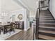 Elegant staircase with dark wood finishes and a chandelier at 208 Switch Grass Ct., Myrtle Beach, SC 29579