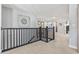 Upper hallway with black railing and carpeting at 208 Switch Grass Ct., Myrtle Beach, SC 29579