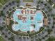 Aerial view of a luxurious community pool surrounded by lush landscaping and ample parking at 2113 Clematis Ct., Myrtle Beach, SC 29579