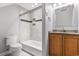 Well-lit bathroom featuring neutral tile, granite countertop, and white fixtures at 2113 Clematis Ct., Myrtle Beach, SC 29579