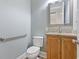 Stylish half bathroom featuring a vanity with a granite countertop and a modern mirror at 2113 Clematis Ct., Myrtle Beach, SC 29579