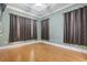 Neutral toned bedroom featuring bamboo flooring, recessed lighting, and dark window treatments at 2113 Clematis Ct., Myrtle Beach, SC 29579
