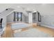 Attic bedroom with gray paint, 2 light gray rugs, and dormer windows with gray curtains at 2113 Clematis Ct., Myrtle Beach, SC 29579