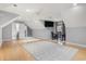 Large attic bedroom with gray walls, bamboo floors, and two rugs with gray accents at 2113 Clematis Ct., Myrtle Beach, SC 29579