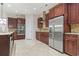 Gourmet kitchen with stainless steel appliances, granite countertops, and custom wood cabinetry at 2113 Clematis Ct., Myrtle Beach, SC 29579