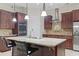 Modern kitchen with stainless steel appliances, updated cabinets, and a large island with barstools at 2113 Clematis Ct., Myrtle Beach, SC 29579