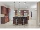 A kitchen featuring a central island with seating, stylish lighting, and modern appliances at 2113 Clematis Ct., Myrtle Beach, SC 29579