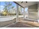 Enclosed brick patio presents backyard views with a ceiling fan for comfortable outdoor living at 2113 Clematis Ct., Myrtle Beach, SC 29579