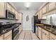 Modern kitchen with stainless steel appliances and granite countertops at 213 Wando River Rd. # E, Myrtle Beach, SC 29579