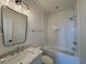 Bathroom featuring a modern vanity with marble countertops and a shower-tub combo at 229 South Waccamaw Dr., Garden City Beach, SC 29576