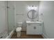Bathroom featuring a modern vanity with marble countertops and a tiled walk-in shower at 229 South Waccamaw Dr., Garden City Beach, SC 29576