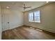 Bright bedroom with ocean views through a large window and modern ceiling fan with recessed lights at 229 South Waccamaw Dr., Garden City Beach, SC 29576