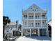 Stunning three-story beach home, showcasing an abundance of outdoor living space and elevated construction at 229 South Waccamaw Dr., Garden City Beach, SC 29576