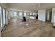 Open-concept living area with modern flooring and kitchen, providing a welcoming atmosphere at 229 South Waccamaw Dr., Garden City Beach, SC 29576