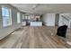 Spacious living room showcasing new flooring, modern kitchen, and bright, airy design at 229 South Waccamaw Dr., Garden City Beach, SC 29576