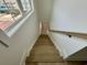 Elegant wooden staircase with a modern railing, providing a seamless transition between floors at 229 South Waccamaw Dr., Garden City Beach, SC 29576