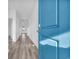 Bright entryway featuring wood-look floors and a vibrant blue front door at 234 Letha Dr, Longs, SC 29568