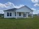 Backyard exterior of the house with a covered porch at 234 Letha Dr, Longs, SC 29568