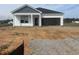 New construction home featuring a two-car garage and covered front porch at 234 Letha Dr, Longs, SC 29568