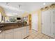 Kitchen with granite countertops, white cabinets, and view into living area at 398 Blue Stem Dr. # 59E, Pawleys Island, SC 29585