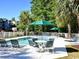 Community pool with seating and umbrellas at 398 Blue Stem Dr. # 59E, Pawleys Island, SC 29585