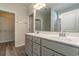 Bathroom with double vanity, gray cabinets, and a walk-in shower at 403 Lifestyle Court, Surfside Beach, SC 29575