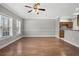 Bright living room with hardwood floors and neutral walls at 4141 Hibiscus Dr. # 102, Little River, SC 29566