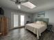 Bright bedroom featuring a king bed, french doors to balcony and a ceiling fan at 4714 Woodland St., North Myrtle Beach, SC 29582