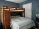 A cozy bedroom with a wooden bunk bed and blue themed bedding at 4714 Woodland St., North Myrtle Beach, SC 29582