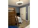 Bedroom with wooden bunkbeds, ladder and drawers, with a television on a stand at 4714 Woodland St., North Myrtle Beach, SC 29582