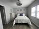 Comfortable bedroom with a decorative ceiling fan, a window and nautical decor at 4714 Woodland St., North Myrtle Beach, SC 29582