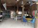 Entertainment space with a ping pong table, chairs, tiki decor, and sports flags at 4714 Woodland St., North Myrtle Beach, SC 29582