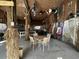 Entertainment space with a ping pong table, chairs, tiki decor, and sports flags at 4714 Woodland St., North Myrtle Beach, SC 29582