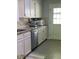 Kitchen featuring white cabinetry, granite countertops, and stainless steel appliances for modern convenience at 4714 Woodland St., North Myrtle Beach, SC 29582
