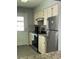 Modern kitchen featuring stainless steel appliances, granite countertops, and white cabinetry with ample storage at 4714 Woodland St., North Myrtle Beach, SC 29582
