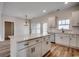 Modern kitchen with white cabinets, stainless steel appliances, and an island at 4979 Dupont Rd., Conway, SC 29526