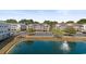 Aerial view of community with pond and building at 5750 Oyster Catcher Dr. # 131, North Myrtle Beach, SC 29582