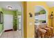 Bright eat-in kitchen with white cabinetry, and view to living room at 5750 Oyster Catcher Dr. # 131, North Myrtle Beach, SC 29582
