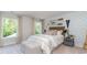 Bright bedroom featuring wavy accent wall, hardwood accents and two large windows for natural light at 578 Haven View Way, Murrells Inlet, SC 29576